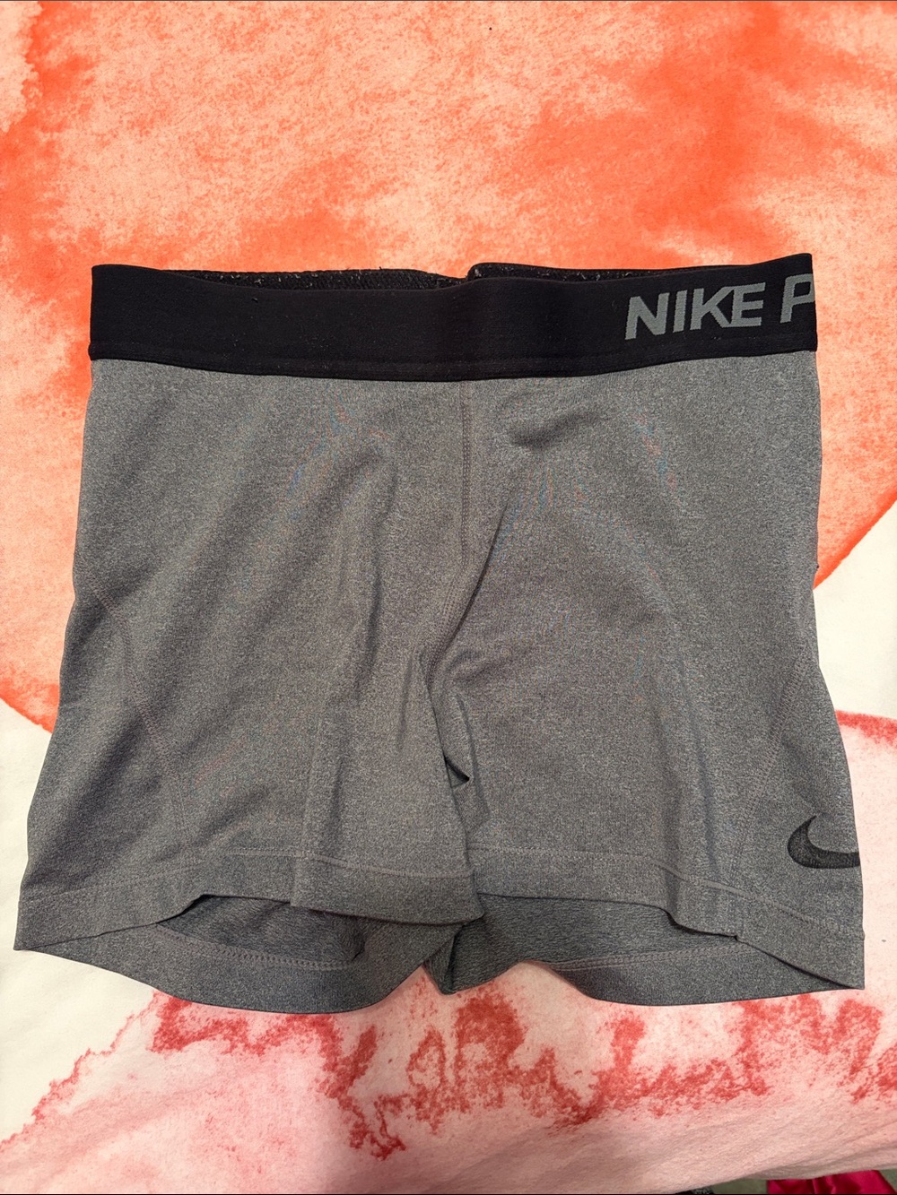 Nike Women's Gray Athletic Shorts with Black Waistband and Swoosh